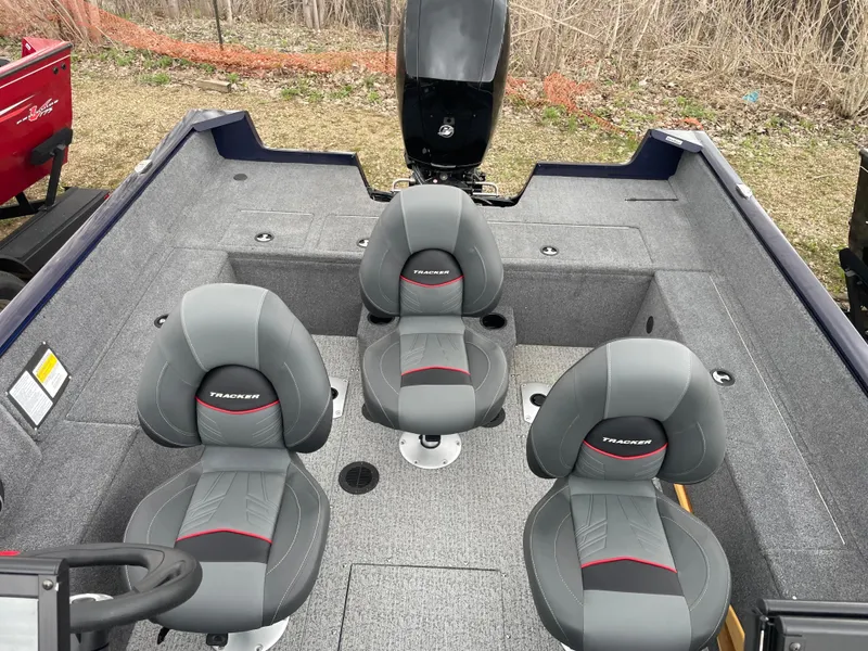 Slide: The Image of 2023 Tracker Pro Guide V-175 WT boat interior with three seats. - 13