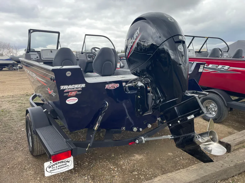 Slide: The Image of 2023 Tracker Pro Guide V-175 WT boat with outboard motor on trailer. - 4