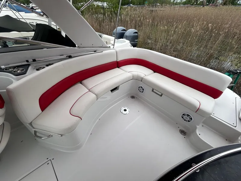 Slide: The Image of 2009 Crownline 300 LS boat interior with white and red seating. - 12