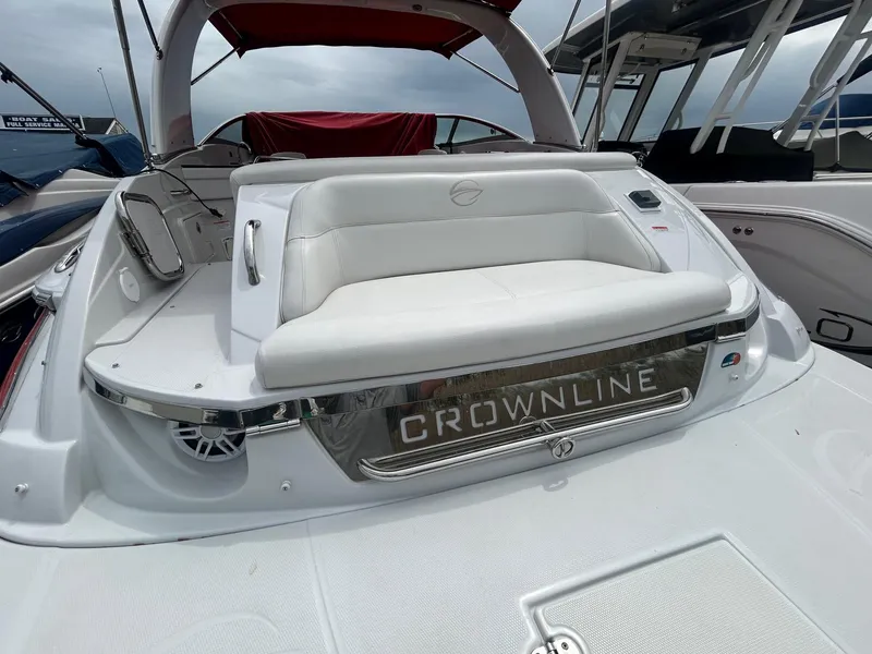 Slide: The Image of 2009 Crownline 300 LS boat with white seating and chrome accents. - 16