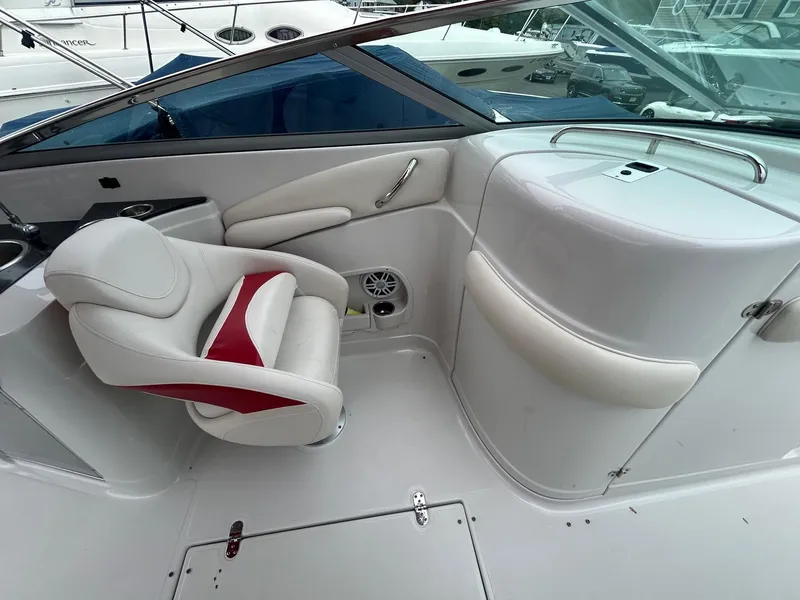 Slide: The Image of 2009 Crownline 300 LS boat interior with white and red seating. - 9