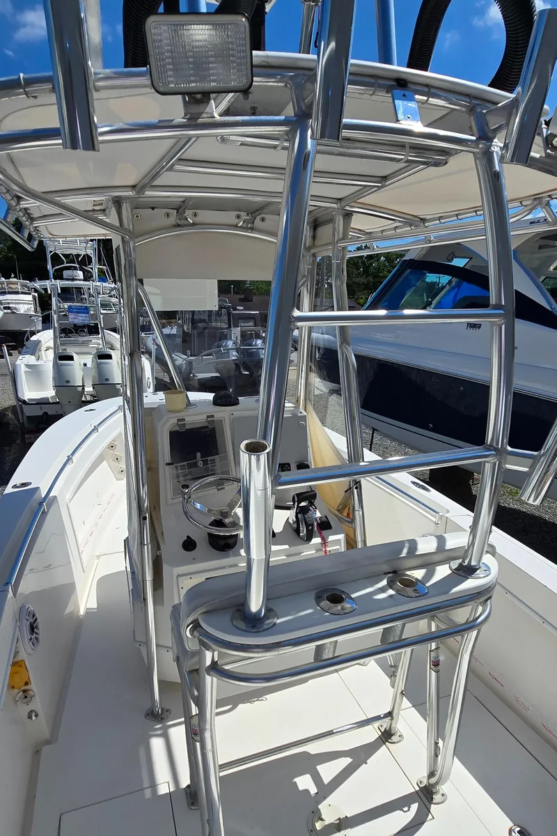 Slide: The Image of 2008 Contender 23 Tournament boat with sleek metal framework and control console. - 13