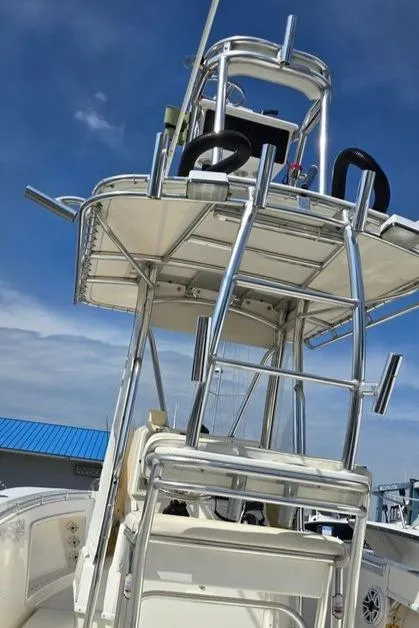Slide: The Image of 2008 Contender 23 Tournament boat with tower against blue sky. - 14