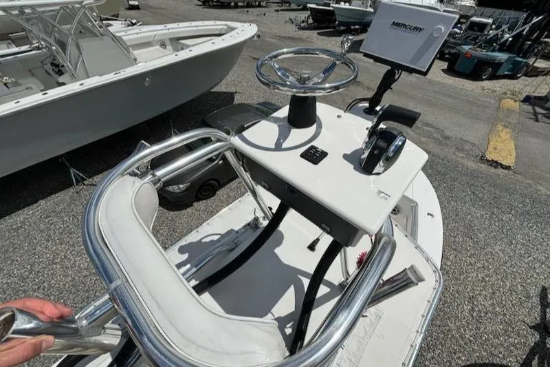 Slide: The Image of 2008 Contender 23 Tournament boat console with steering wheel and controls. - 16