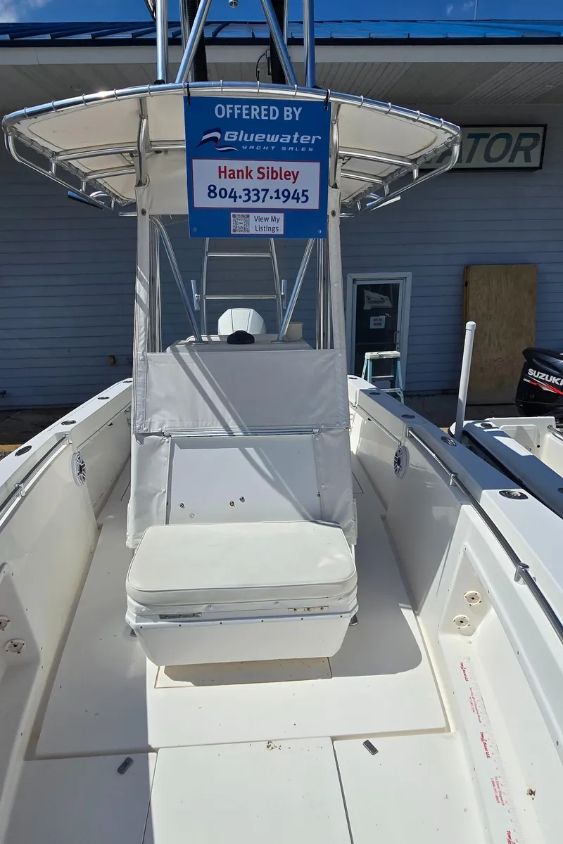 Slide: The Image of 2008 Contender 23 Tournament boat with seating and canopy, offered by Bluewater. - 17