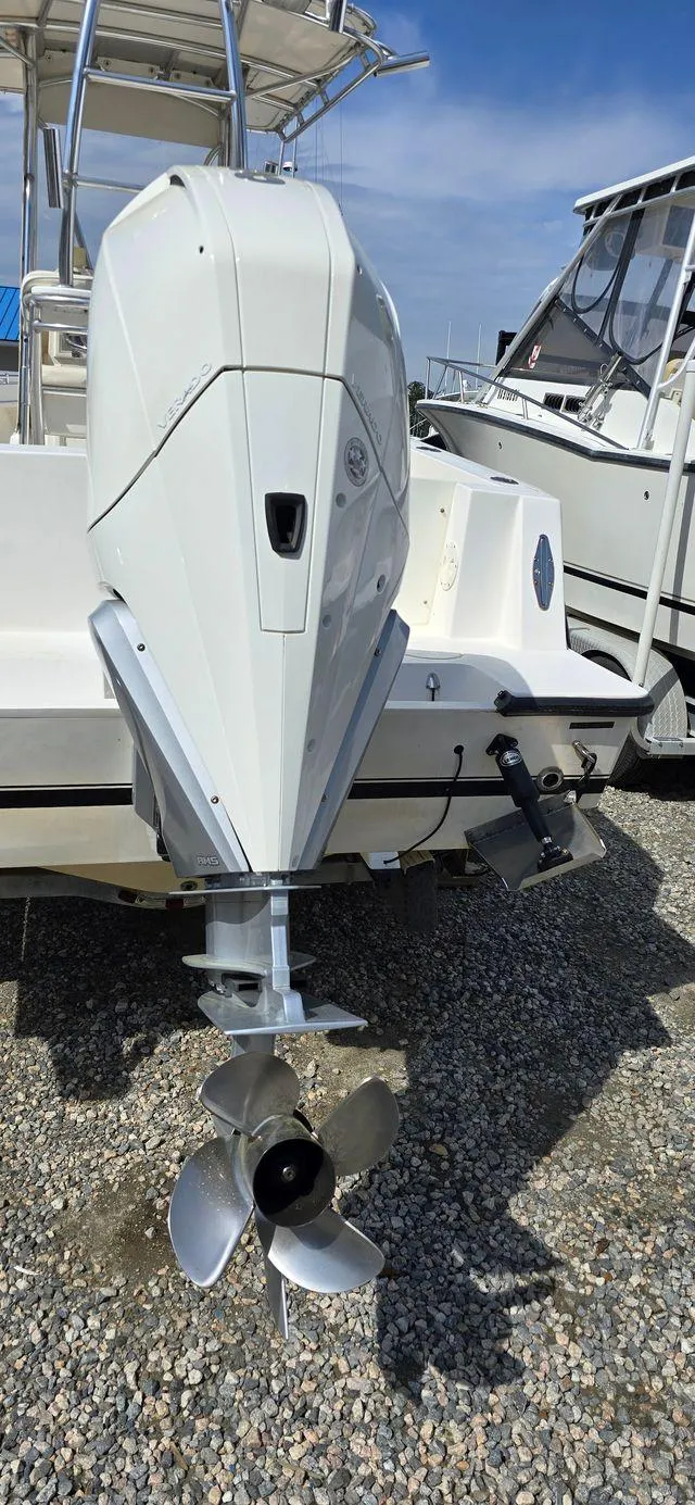Slide: The Image of 2008 Contender 23 Tournament boat with outboard motor. - 25