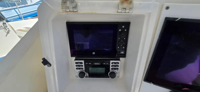 Slide: The Image of 2008 Contender 23 Tournament boat dashboard with electronic controls and display. - 5