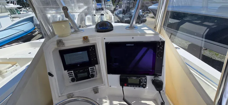 Slide: The Image of 2008 Contender 23 Tournament boat dashboard with navigation and communication equipment. - 8