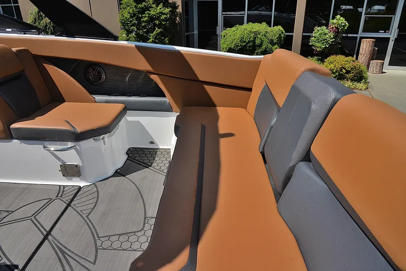 Slide: The Image of 2024 Scarab 255 ID boat interior with tan and gray seating. - 10