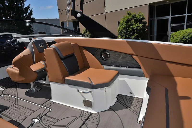 Slide: The Image of 2024 Scarab 255 ID boat interior with tan and black seating. - 12