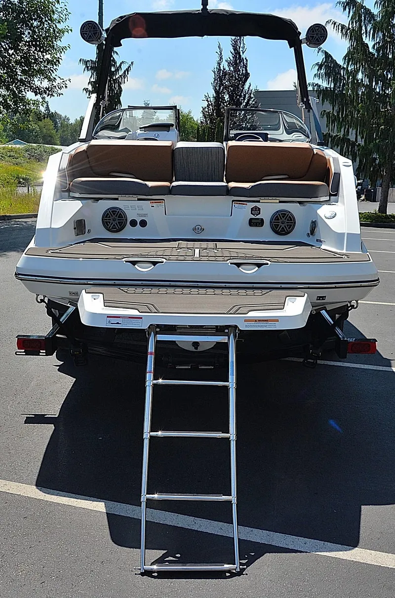 Slide: The Image of 2024 Scarab 255 ID boat with rear view and extended ladder. - 15