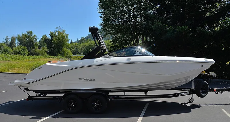 Slide: The Image of 2024 Scarab 255 ID boat on a trailer in a parking lot. - 3
