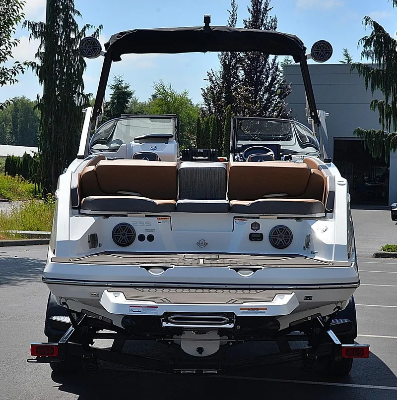 Slide: The Image of 2024 Scarab 255 ID boat, rear view, parked outdoors. - 9