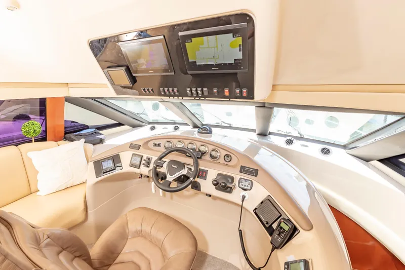 Slide: The Image of Luxurious helm of a 2004 Carver 56 Voyager SE yacht with advanced navigation systems. - 10