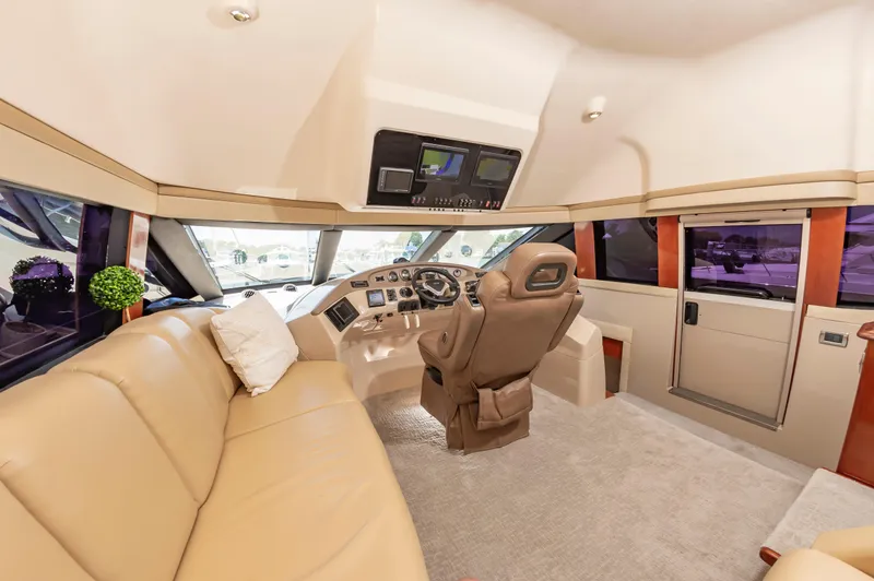 Slide: The Image of Luxurious interior of 2004 Carver 56 Voyager SE yacht with leather seating and modern helm. - 11