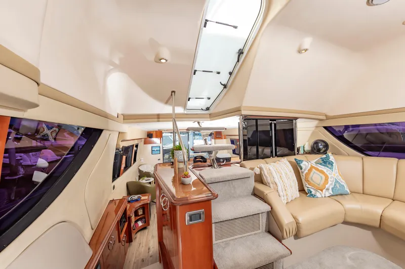 Slide: The Image of Interior of 2004 Carver 56 Voyager SE yacht with luxurious seating and modern decor. - 12