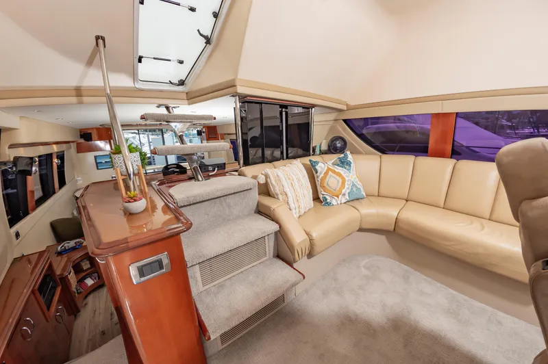 Slide: The Image of Luxurious interior of 2004 Carver 56 Voyager SE yacht with beige leather seating. - 13
