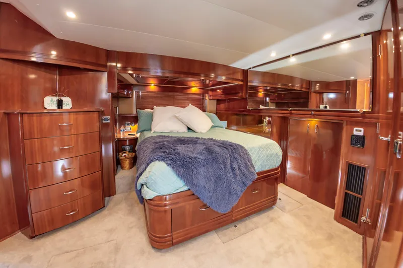 Slide: The Image of Luxurious master bedroom in 2004 Carver 56 Voyager SE yacht with wood cabinetry. - 14