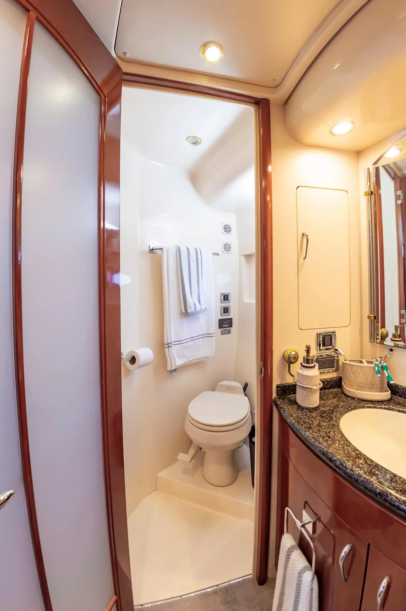 Slide: The Image of 2004 Carver 56 Voyager SE yacht bathroom with modern fixtures and granite countertop. - 19