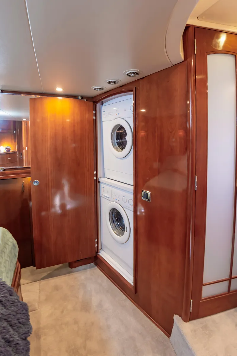 Slide: The Image of Laundry area in 2004 Carver 56 Voyager SE yacht with wood paneling. - 20