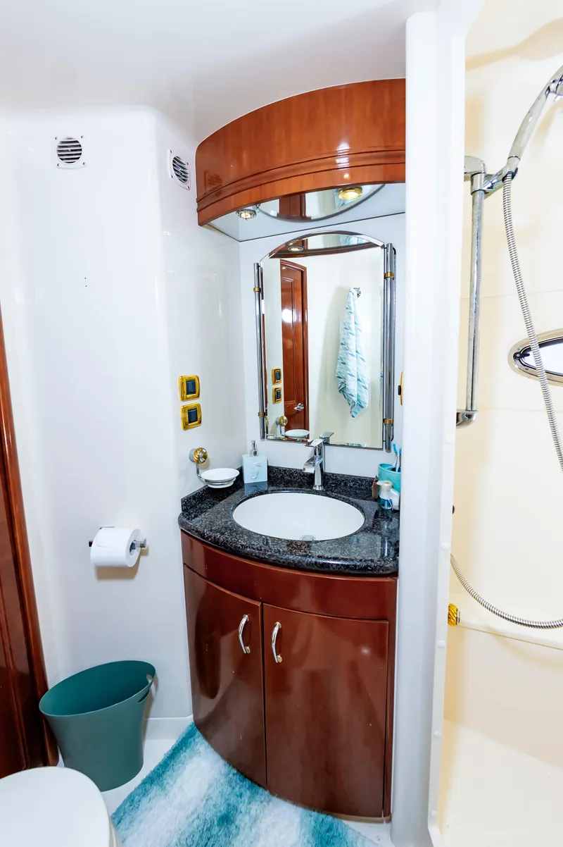 Slide: The Image of 2004 Carver 56 Voyager SE bathroom with sink, mirror, and shower. - 24