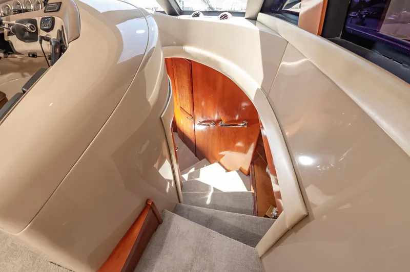 Slide: The Image of Interior staircase of 2004 Carver 56 Voyager SE yacht with wooden doors. - 30