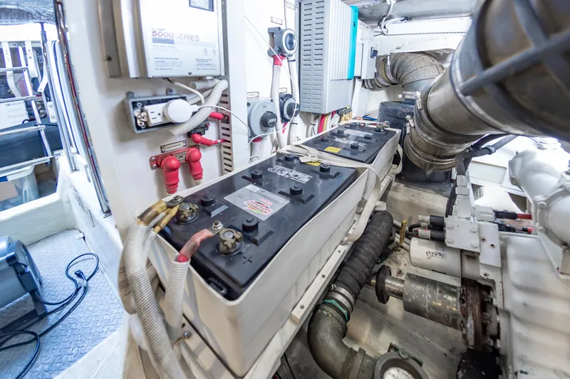 Slide: The Image of 2004 Carver 56 Voyager SE engine room with batteries and wiring. - 47