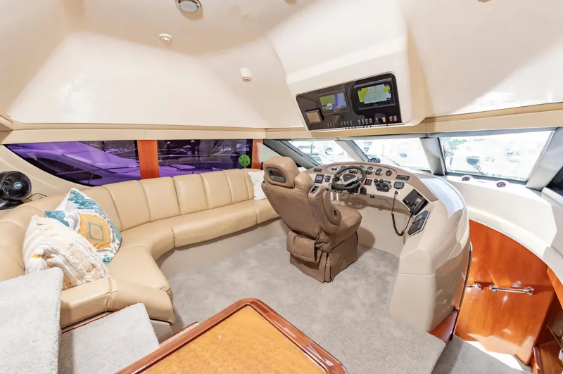 Slide: The Image of Luxurious interior of a 2004 Carver 56 Voyager SE yacht with plush seating and modern helm. - 6