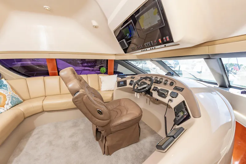 Slide: The Image of Interior helm of 2004 Carver 56 Voyager SE yacht with leather seating and advanced navigation. - 7