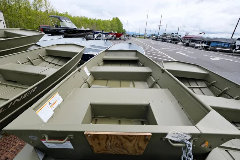 Slide: The Image of 2024 Crestliner 1040 CR Jon boats displayed in a dealership lot. - 3