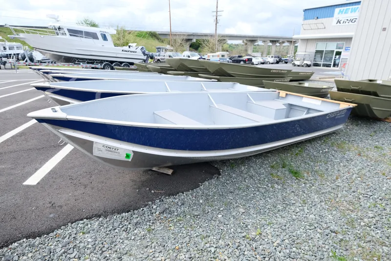 The Image of 2024 Crestliner 1672 Outreach boats displayed in a dealership lot. - 0