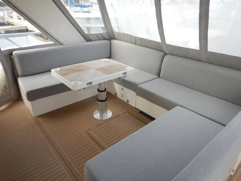 Slide: The Image of Interior of 2012 Sealine S450 yacht with gray seating area. - 12