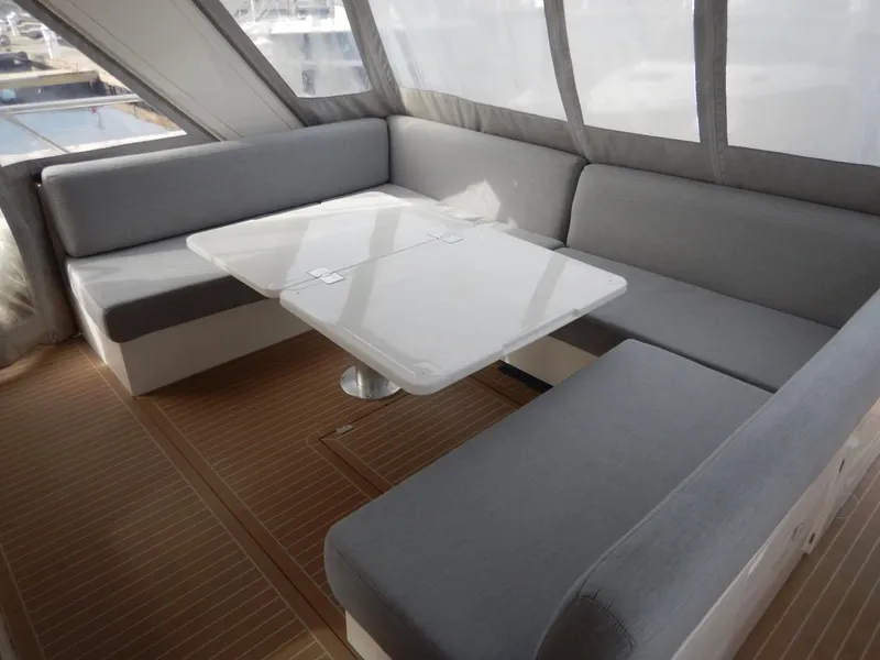 Slide: The Image of Interior of 2012 Sealine S450 yacht with gray seating and table. - 13
