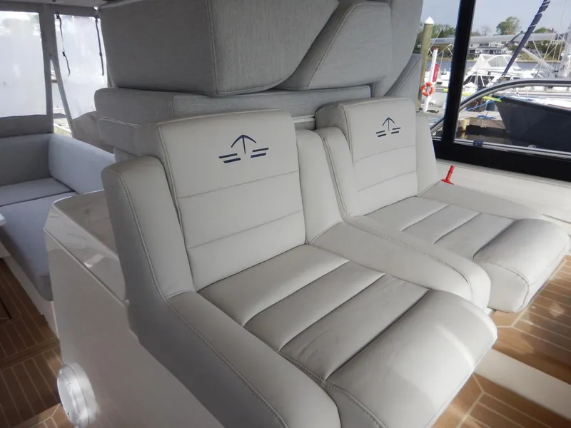 Slide: The Image of Interior of 2012 Sealine S450 yacht featuring luxurious seating. - 14