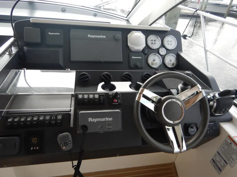 Slide: The Image of Sealine S450 yacht helm, 2012 model, featuring Raymarine equipment. - 16