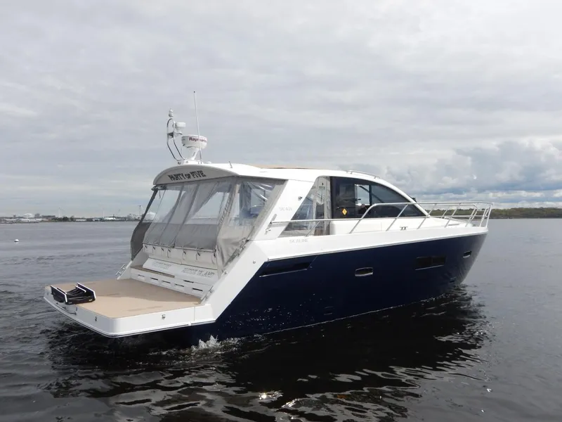 Slide: The Image of 2012 Sealine S450 yacht cruising on calm waters. - 3