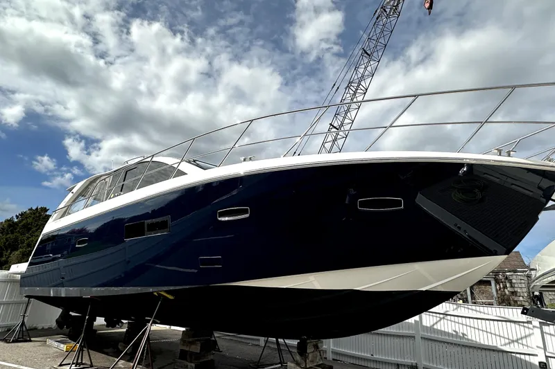 Slide: The Image of 2012 Sealine S450 yacht on dry dock under a cloudy sky. - 38