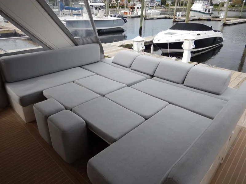 Slide: The Image of Sealine S450 2012 yacht with gray lounge area at the marina. - 9