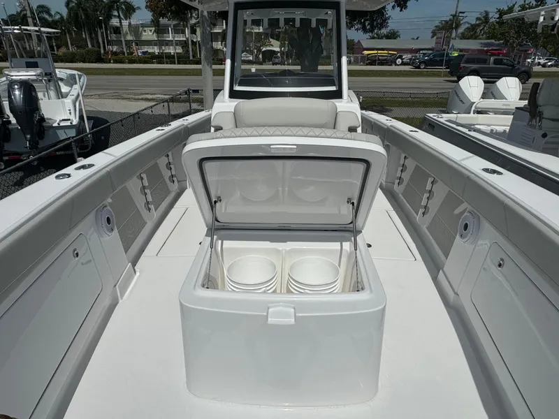 Slide: The Image of 2024 Jupiter 340LS boat with open storage compartment on deck. - 13