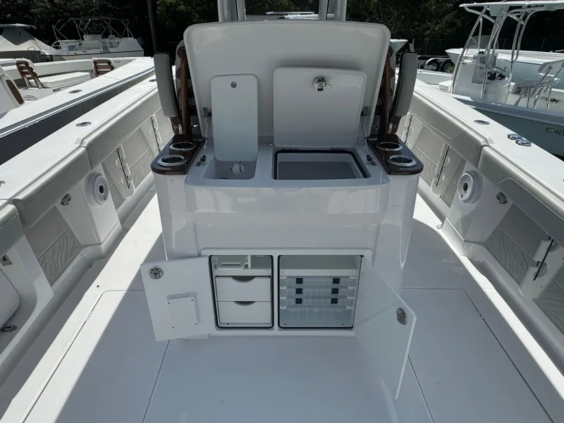 Slide: The Image of 2024 Jupiter 340LS boat interior with storage compartments and seating. - 5