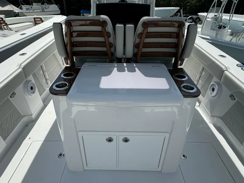 Slide: The Image of 2024 Jupiter 340LS boat interior with seating and storage compartments. - 6