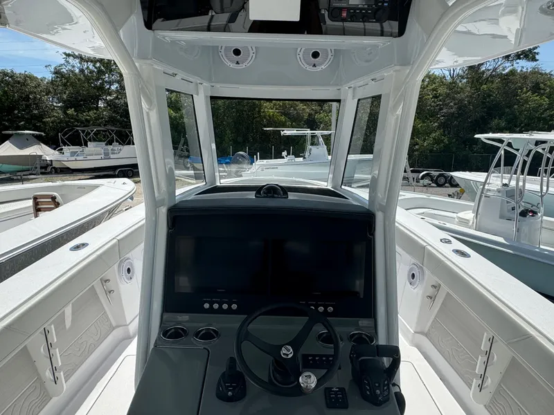Slide: The Image of 2024 Jupiter 340LS boat cockpit with modern controls and navigation system. - 7