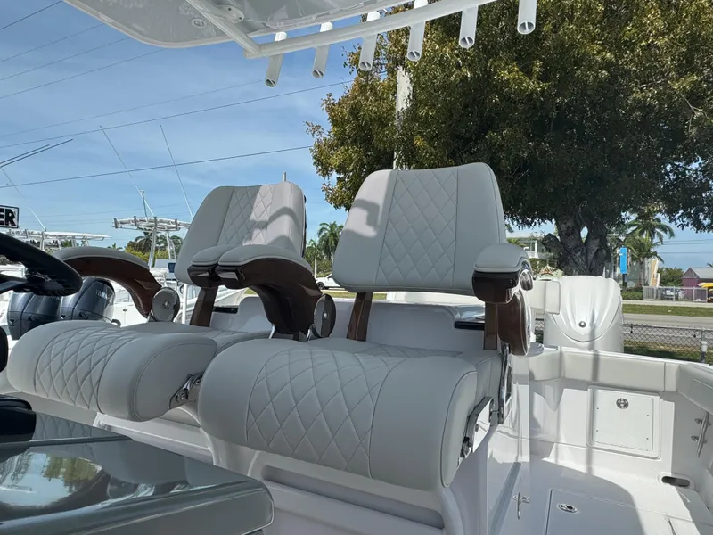 Slide: The Image of 2024 Jupiter 340LS boat with luxurious white leather seating. - 8