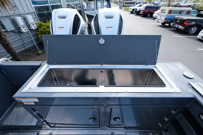 Slide: The Image of 2024 Hewescraft 250 Explorer boat with dual engines and storage compartment. - 21