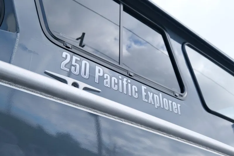 Slide: The Image of 2024 Hewescraft 250 Explorer boat exterior with logo and windows. - 4