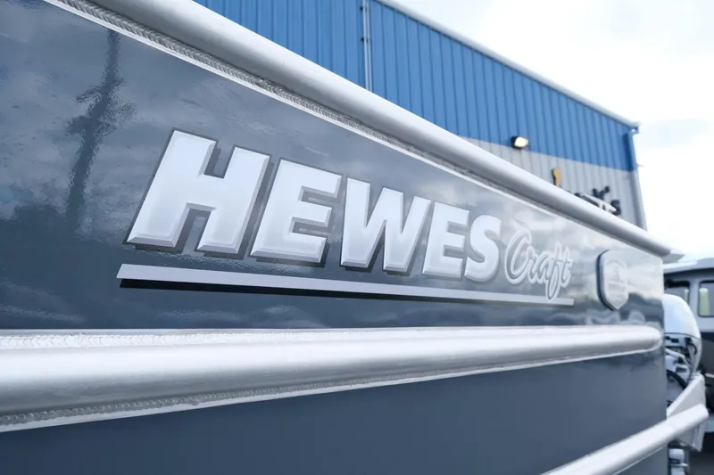 Slide: The Image of 2024 Hewescraft 250 Explorer boat exterior with logo detail. - 22