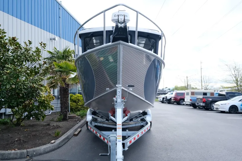 Slide: The Image of 2024 Hewescraft 250 Explorer boat on trailer in parking lot. - 3