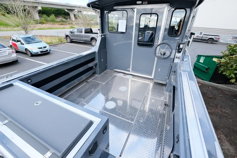 Slide: The Image of 2024 Hewescraft 250 Explorer boat interior with spacious deck and modern design. - 7