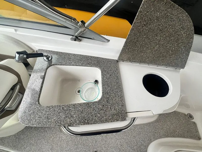 Slide: The Image of 2013 Chaparral 244 Sunesta boat sink and countertop area. - 12