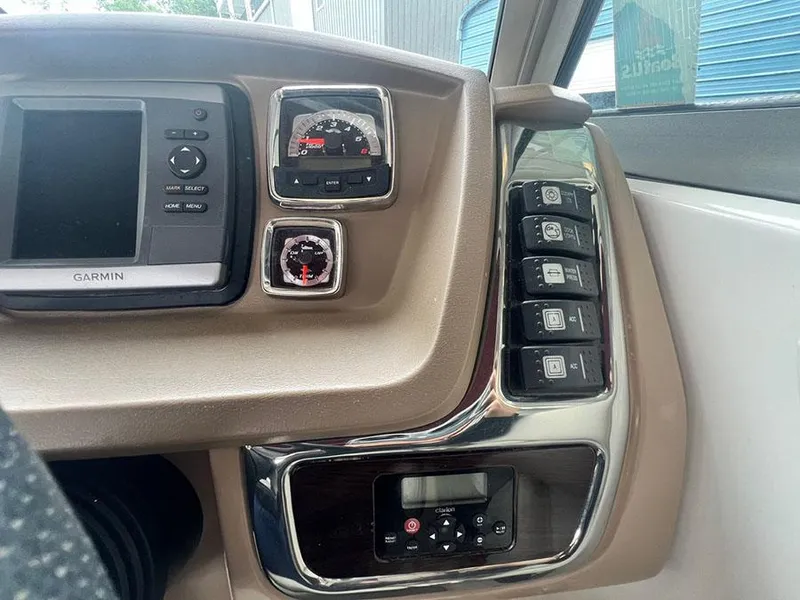 Slide: The Image of Dashboard of a 2013 Chaparral 244 Sunesta boat with Garmin navigation system. - 19